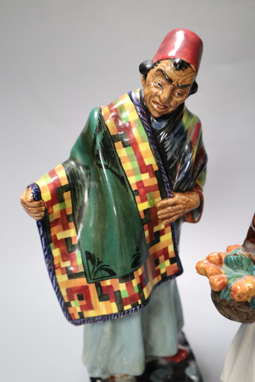 Four Royal Doulton figures, Carpet Seller, Mask Seller, Country Lass, Mary had a Little Lamb